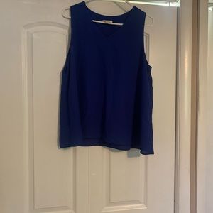 EST 1946 blue sleeveless top. Pre-loved condition.